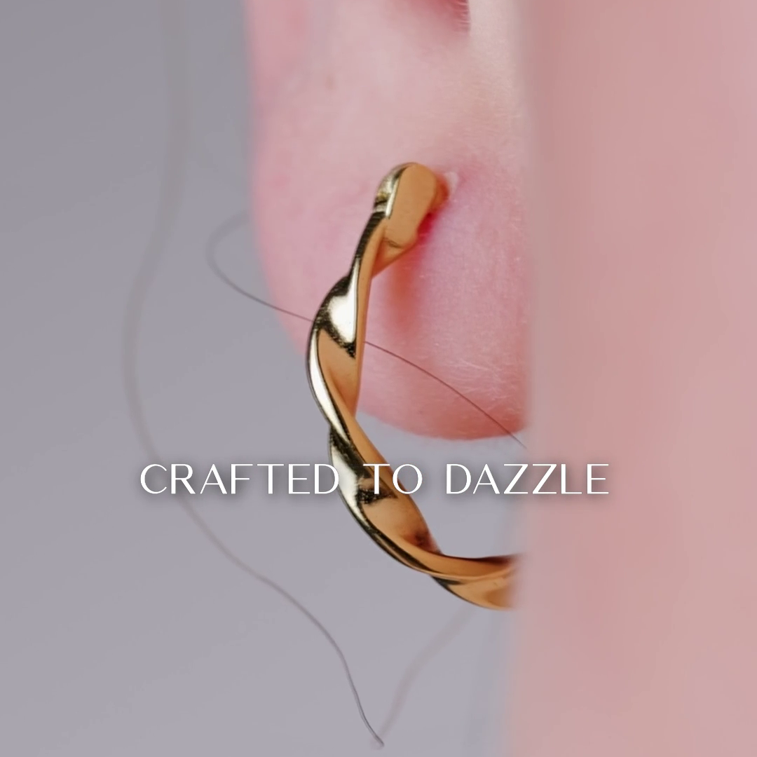 Gold hoop earring worn on Twisted Rope Large Hoop with 'Crafted to Dazzle' text.